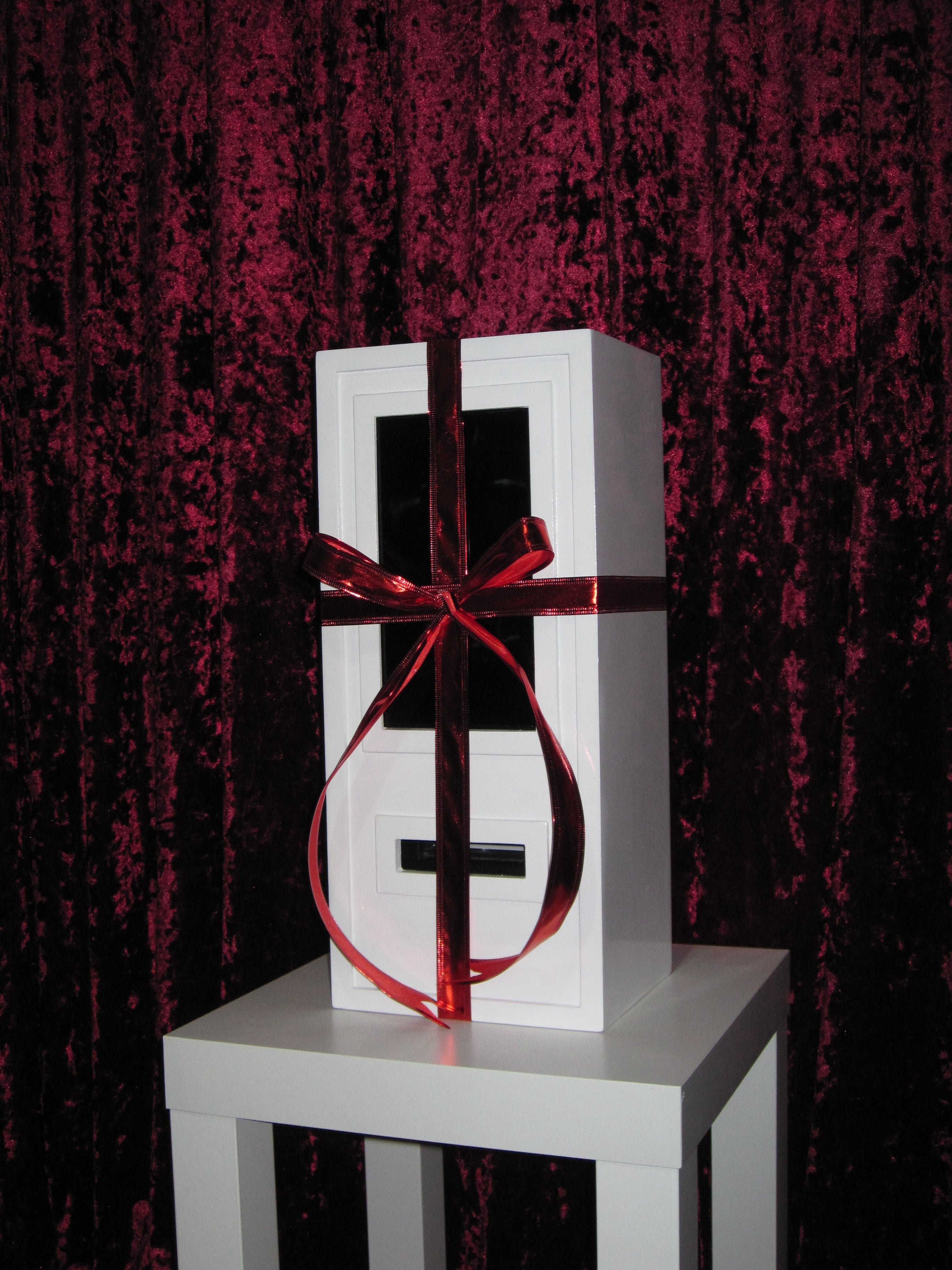 The booth dressed with ribbon as a gift, styled for a holiday celebration