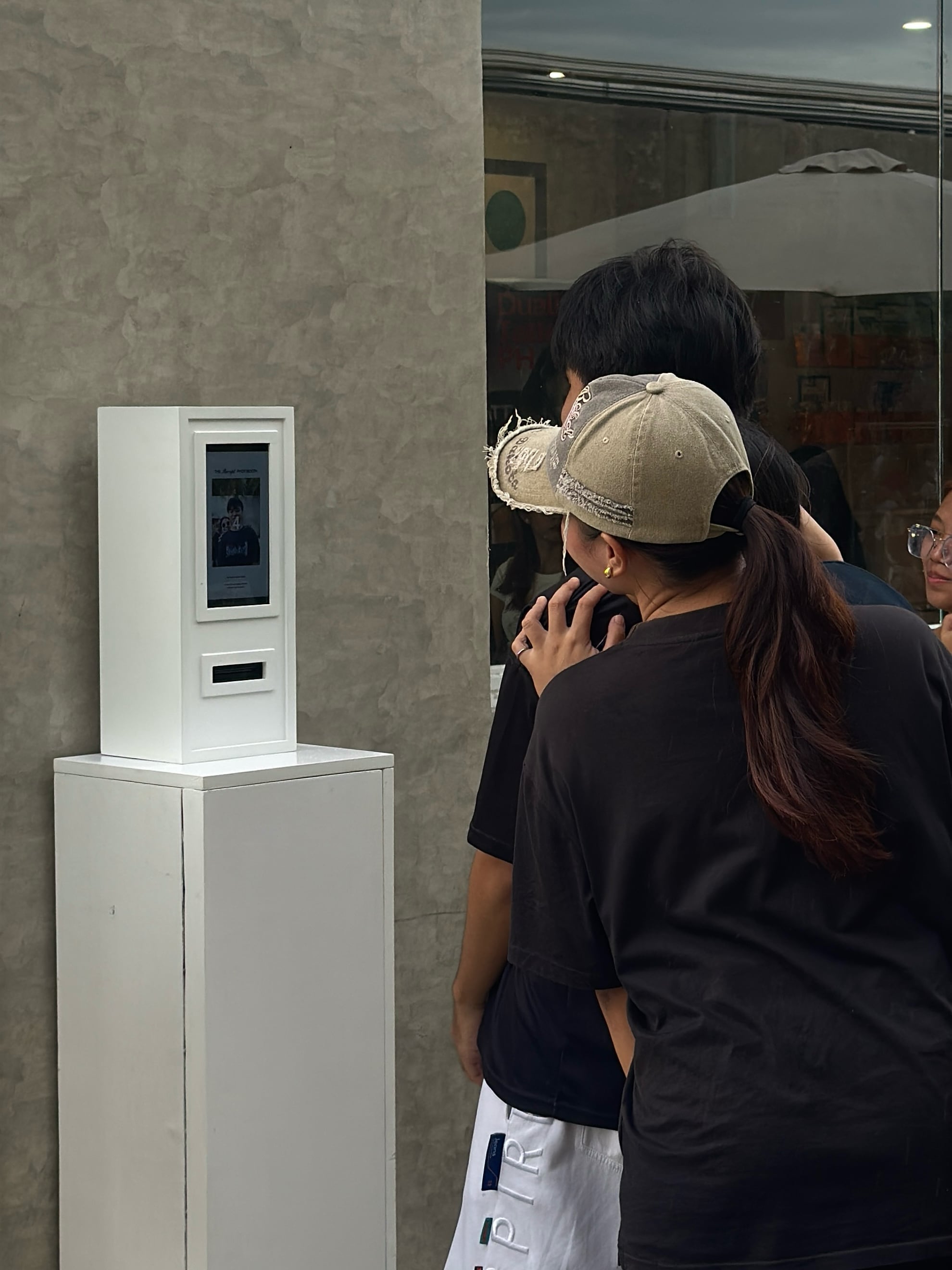 Guests gathered around the Receipt Booth at an event